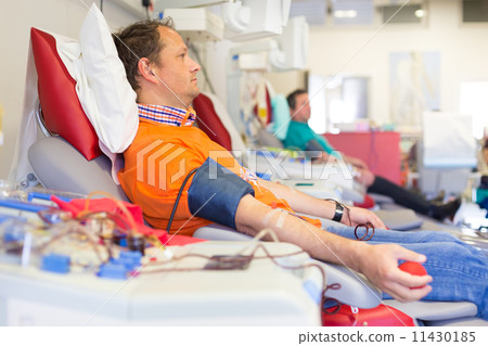 Blood donor at donation. Blood donor at donation. 11430185