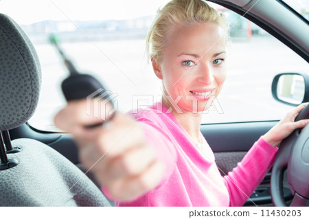 Woman driver showing car keys. Woman driver showing car keys. 11430203