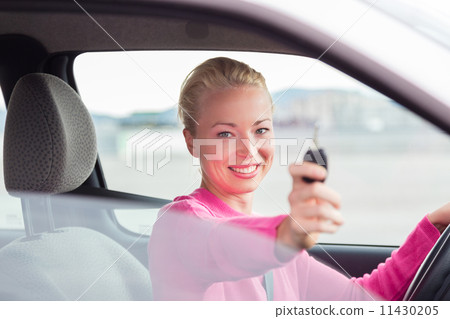 Woman driver showing car keys. Woman driver showing car keys. 11430205