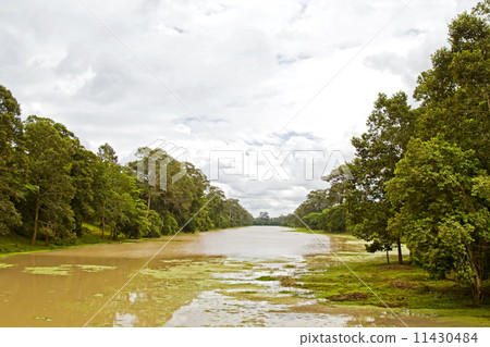 The ditch around Angkor Thom (ancient royal city). Siem Reap, Ca 11430484