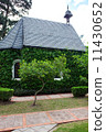 small chapel with green trees 11430652