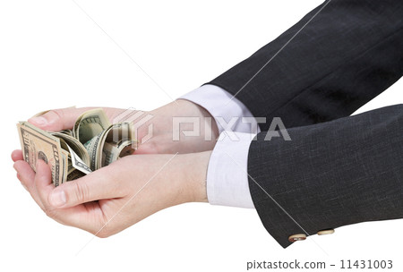 pile of dollars banknotes in businessman handful pile of dollars banknotes in businessman handful 11431003