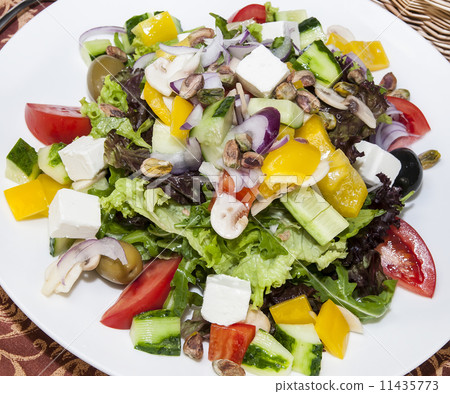 Greek salad on a white background in the restaurant 11435773