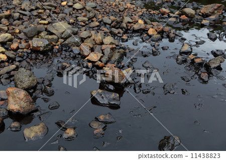 Oil spill on the sea shore Oil spill on the sea shore 11438823