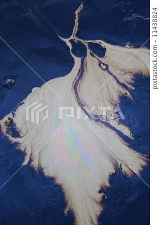 crude oil in sea water and rainbow reflection 11438824