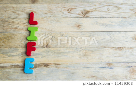 Colorful wooden word Life on wooden floor2 11439308