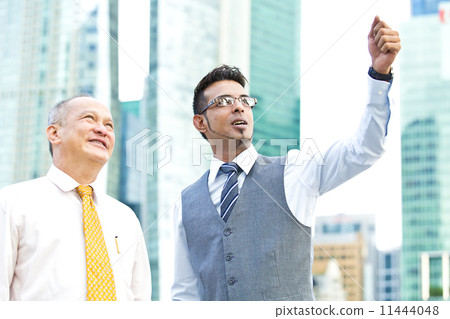 Young and senior executive point at a direction Young and senior executive point at a direction 11444048