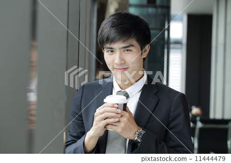 Businessman drink a cup of coffee 11444479