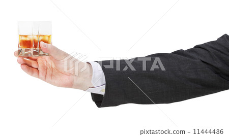 side view of whiskey glass in businessman hand 11444486