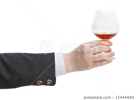 toast with brandy glass in businessman hand 11444489