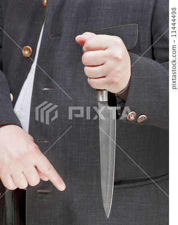 large knife in businessman hand 11444498