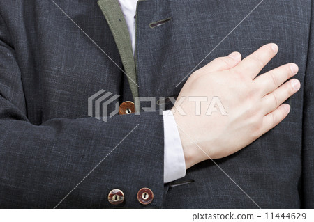 businessman holding his hand on his chest 11444629