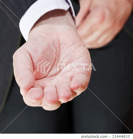 front view of businessman holding empty handful 11444633