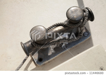 Black bollard with rope knot on yacht deck 11446680