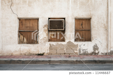 Old building wall with windows and outer air conditioner device. 11446687