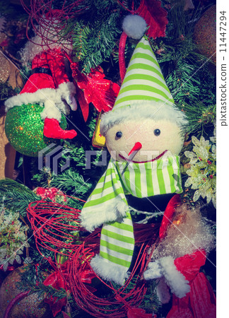 Funny christmas toy. Snowman  on firtree 11447294