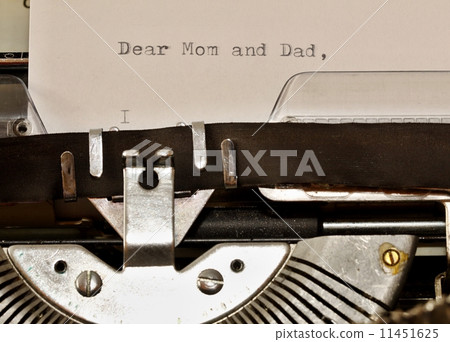Text Dear Mom and Dad typed on old typewriter 11451625