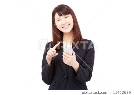 Business woman laughing with a smartphone Business woman laughing with a smartphone 11452689