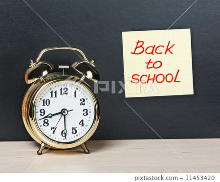 alarm clock and sticker with text back to school on the chalkboa alarm clock and sticker with text back to school on the chalkboa 11453420