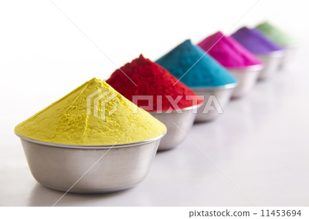Row of colorful Holi powder in containers over white background 11453694