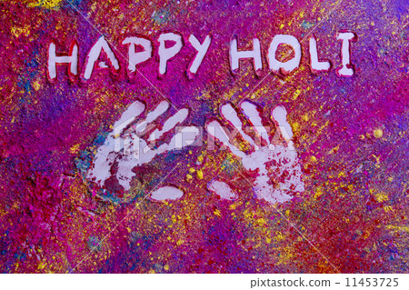 High angle view of handprints with text HAPPY Holi written on rangoli 11453725