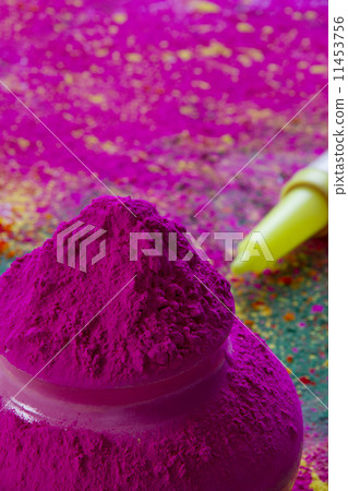 Close-up of pink Holi color powder with water gun in background 11453756
