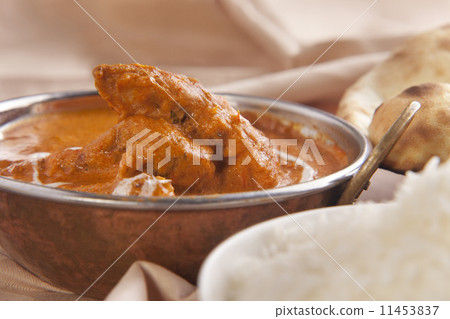 Butter chicken served in container 11453837