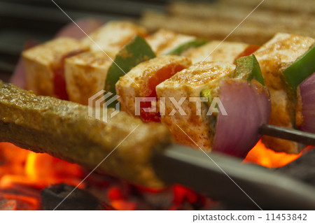Minced meat and cottage cheese kabab being barbecued 11453842