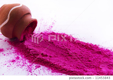 Pink Holi color powder spilt from pot over white background 11453843