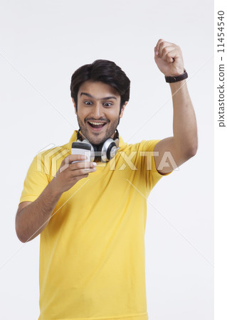 Young man looking at mobile phone 11454540