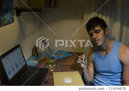Young man with cocaine at home 11454676