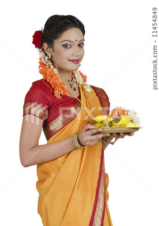 Portrait of a South Indian woman holding a thali Portrait of a South Indian woman holding a thali 11454849