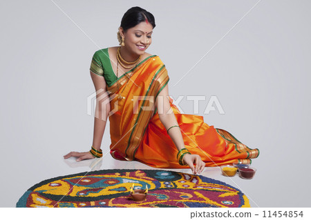 Maharashtrian woman making a rangoli 11454854