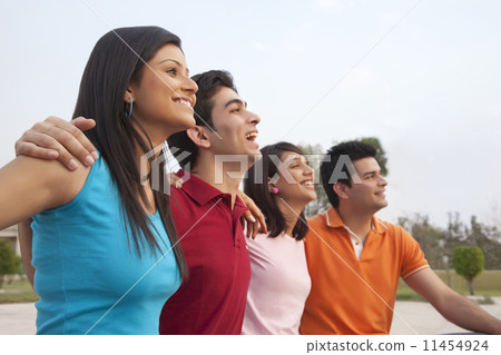 Happy friends looking away outdoors 11454924