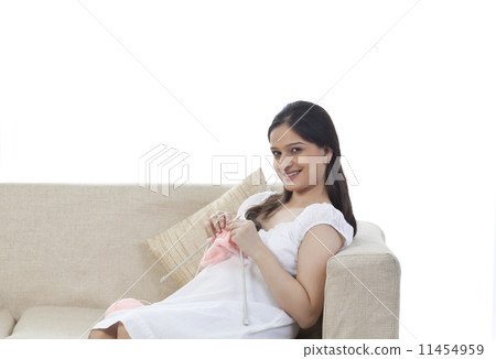 Pregnant woman knitting 11454959