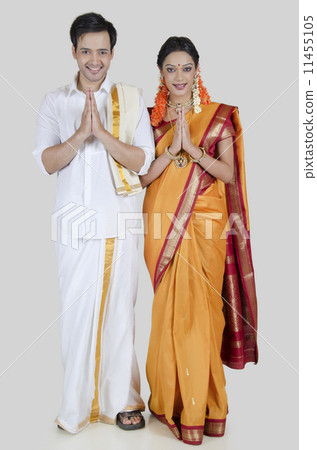 South Indian couple praying Stock Photo - Alamy