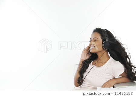Woman with headphones listening to music 11455197