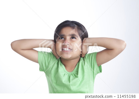 Little girl covering her ears 11455198