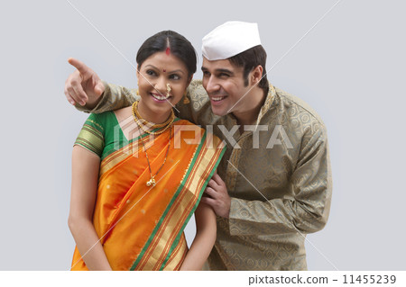 Maharashtrian man pointing something out to woman 11455239