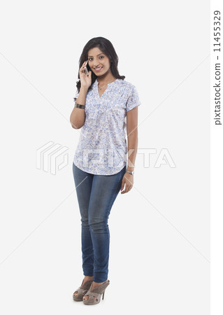 Portrait of young woman talking on mobile phone Portrait of young woman talking on mobile phone 11455329
