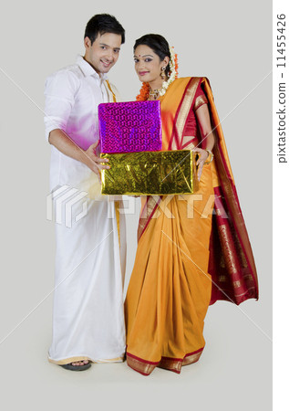 Portrait of South Indian couple with gifts 11455426