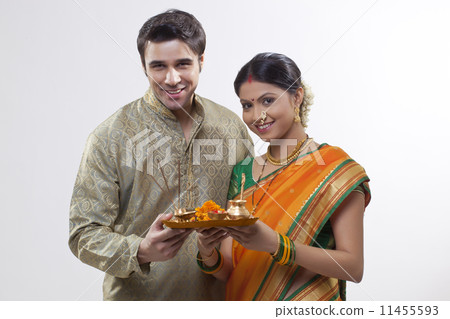 Portrait of Maharashtrian couple holding a puja thali Portrait of Maharashtrian couple holding a puja thali 11455593