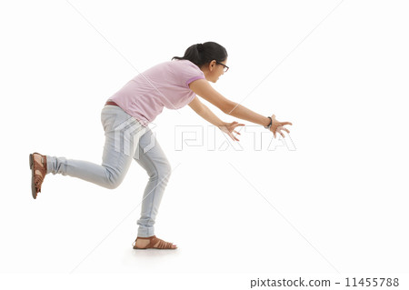 Young woman trying to catch Young woman trying to catch 11455788