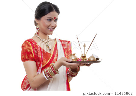 Bengali woman holding a puja thali Bengali woman holding a puja thali 11455962