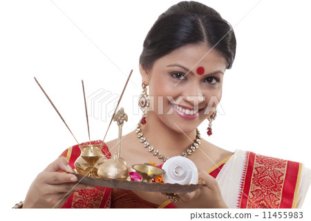 Portrait of a Bengali woman holding a puja thali 11455983
