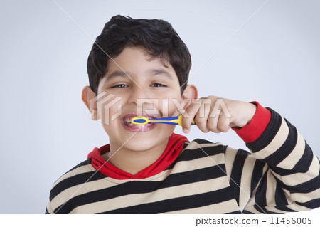 Portrait of little boy brushing his teeth Portrait of little boy brushing his teeth 11456005