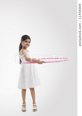 Portrait of a little girl with a hoola hoop 11456009