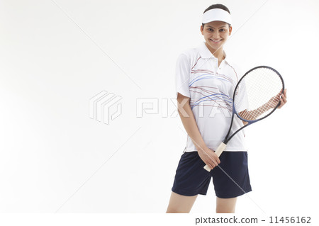 Portrait of happy young woman holding tennis racket isolated over gray background 11456162