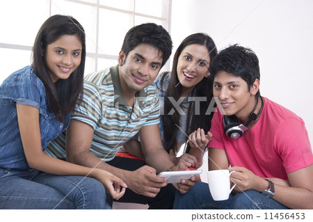 Portrait of happy friends spending leisure time in college Portrait of happy friends spending leisure time in college 11456453