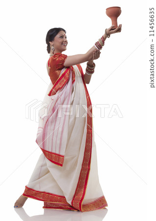 Bengali woman doing Dhunuchi dance 11456635